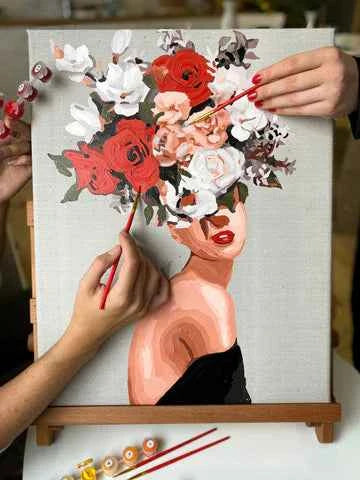 Artistic depiction of a face with flowers and a person painting it
